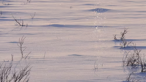 Koskullskulle – Tromsø Ein paar Schneekristalle schwirren in der Luft