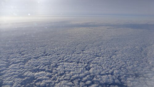 Longyearbyen – Tromsø Über den Wolken.